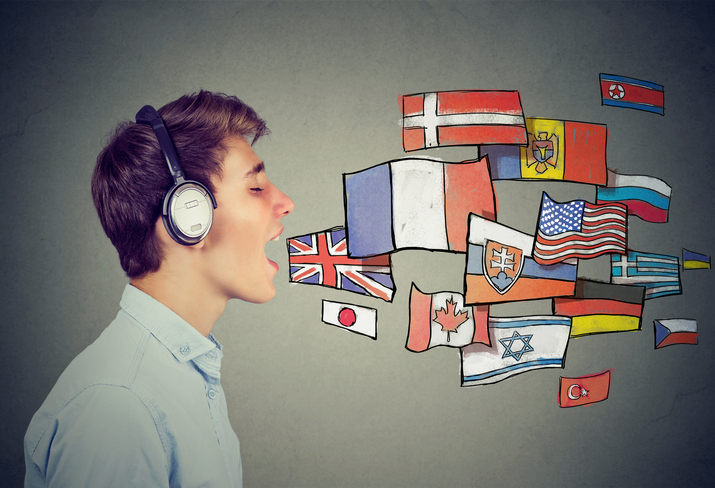 Young man learning different languages